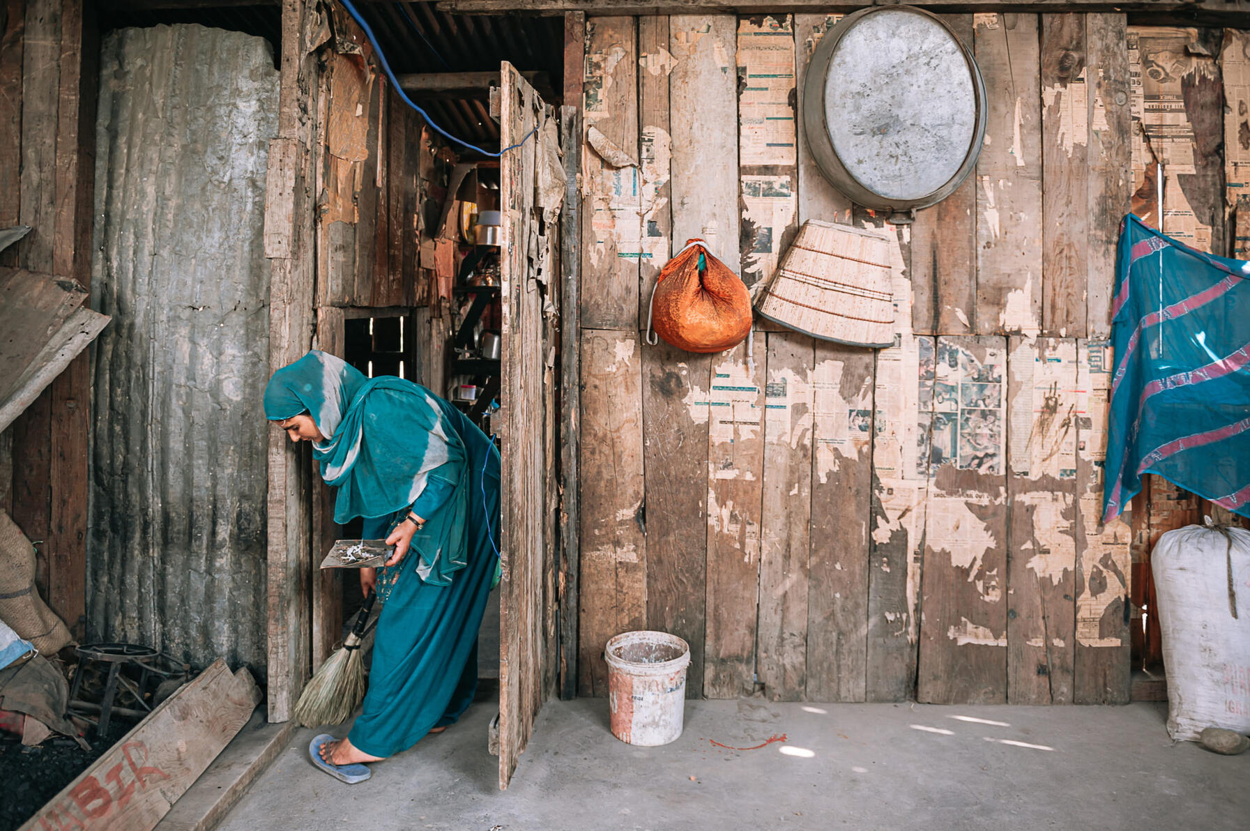 Shamima cleans her home